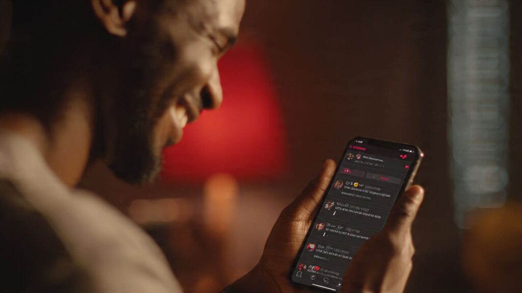 Nigerian content creator smiling at phone showing viral post with high reactions and comments