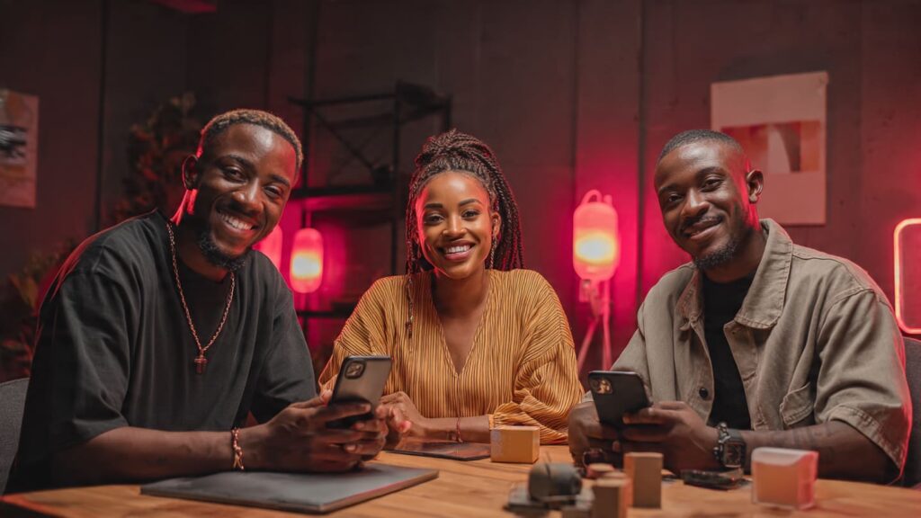 Group of Nigerian micro-influencers collaborating on brand content creation for a Lagos business