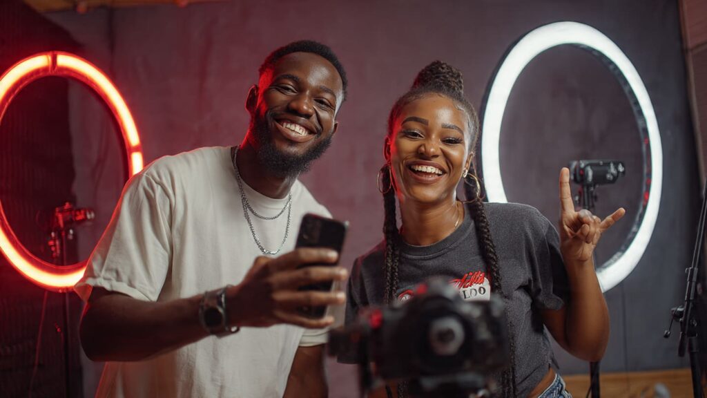 Two Nigerian content creators filming a collab Reel together for Instagram in Lagos